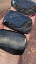 Load and play video in Gallery viewer, Silver Sheen Obsidian Palm Stones (flat on one side)

